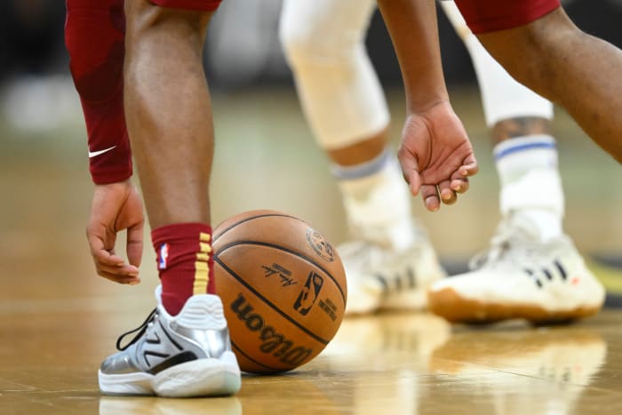 Nov 28, 2023; Cleveland, Ohio, USA; Cleveland Cavaliers guard Darius Garland (10) picks up the ball in the second quarter against the Atlanta Hawks at Rocket Mortgage FieldHouse.